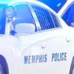 Police investigate a fatal crash scene at a Memphis intersection with cones and emergency vehicles
