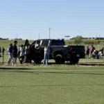 Police and emergency crews respond after a pickup truck entered a youth soccer field in Wichita