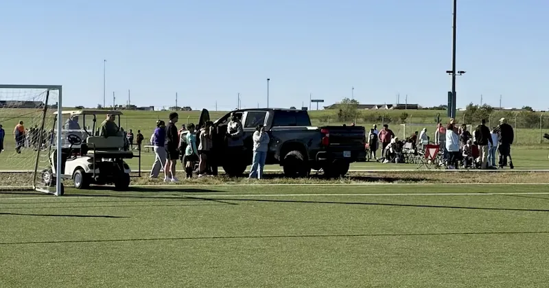 Police and emergency crews respond after a pickup truck entered a youth soccer field in Wichita