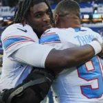 Titans players celebrate after a comeback win over the Colts in Indianapolis