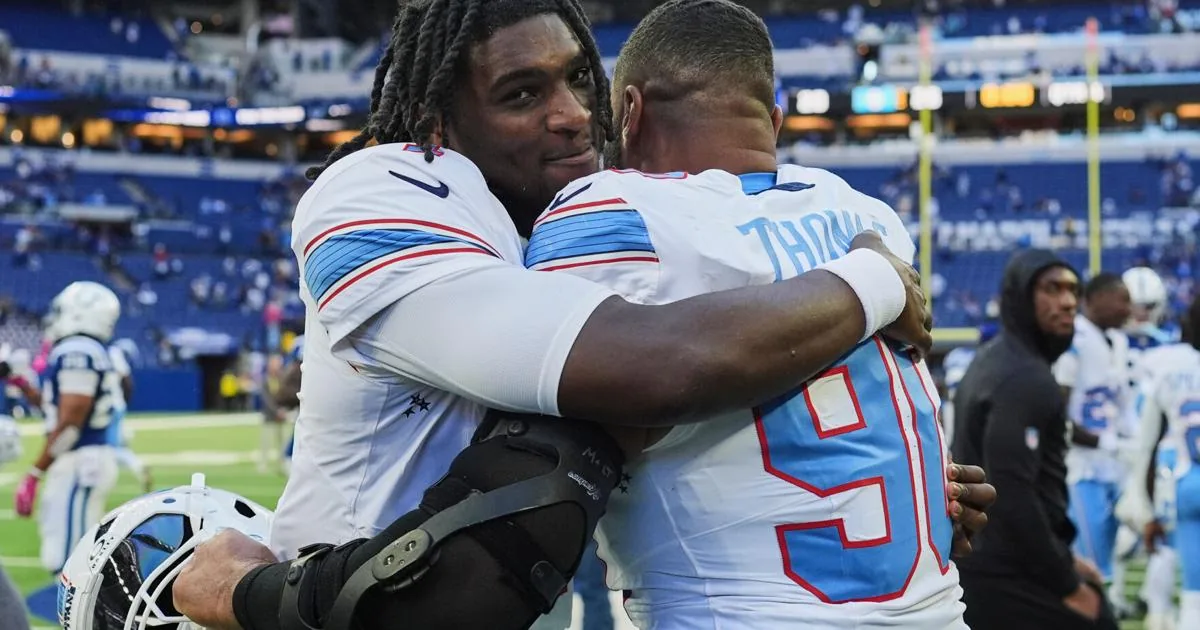 Titans players celebrate after a comeback win over the Colts in Indianapolis