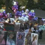 Mourners release purple and silver balloons during a vigil for Renisha Thompson in Memphis