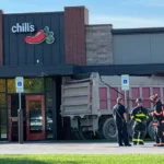 Police respond after a dump truck crashes into a Chili's restaurant in Avon, Ohio