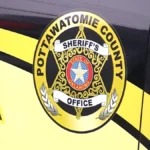 A sheriff's vehicle parked near a rural property in Pottawatomie County, Oklahoma